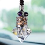 Diamond-shaped empty crystal hanging car air freshener bottle with wooden cap, rear view mirror accessory.