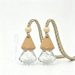 Set of 2 hanging car air fresheners, empty refillable glass bottles with wooden cap and hanging cord.